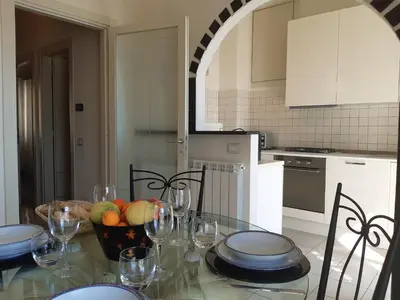 Cucina o angolo cottura di House La Baia delle Favole by Holiday World