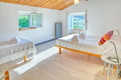 Letto o letti in una camera di il Frantoio del Mesco - Levanto