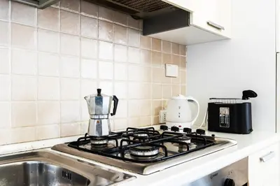 Cucina o angolo cottura di GuestHost - Migliarina Cozy Apartment