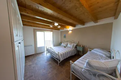 Letto o letti in una camera di La Beppa - Casa Vacanza