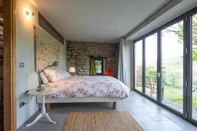 Letto o letti in una camera di Nido d’amore nei colori