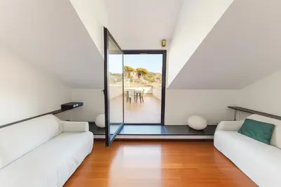 Area soggiorno di WELCOME RIVIERA - ATTICO SAN FAUSTINO 165 mq più 110 mq di terrazza- IN VILLA 700 ,VISTA MARE STREPITOSA-100 m dalla spiaggia-PARKING ESCLUSIVO