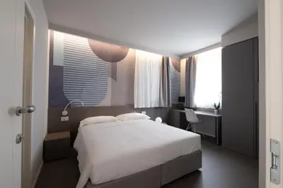 Letto o letti in una camera di Zeta T Rooms
