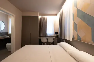 Letto o letti in una camera di Zeta T Rooms