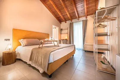 Letto o letti in una camera di Le Ferrerie agriturismo fattoria Marchesini