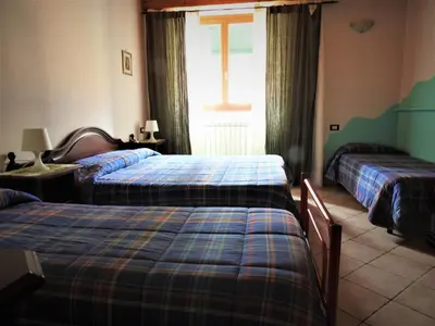 Letto o letti in una camera di Affittacamere 