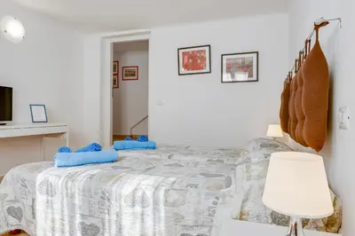 Letto o letti in una camera di GuestHost - La Spezia Migliarina Bedrooms