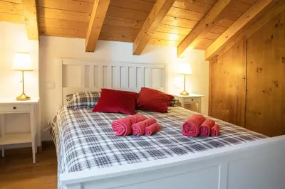 Letto o letti in una camera di Mansarda Villa Adele