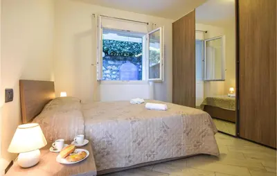 Letto o letti in una camera di 2 Bedroom Cozy Apartment In Moneglia