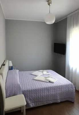 Letto o letti in una camera di Casa Jomi b&b Borghetto Lodigiano