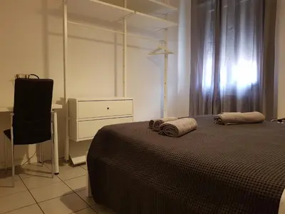 Letto o letti in una camera di Casa Bebe - adiacenze Policlinico e Universita'