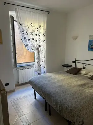 Letto o letti in una camera di Appartamento in tipico carugio ligure