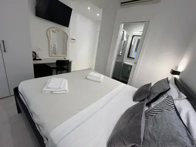 Letto o letti in una camera di Affittacamere Sull'Arco