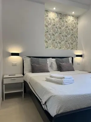 Letto o letti in una camera di Affittacamere Sull'Arco