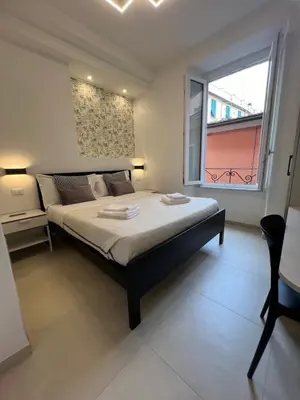 Letto o letti in una camera di Affittacamere Sull'Arco