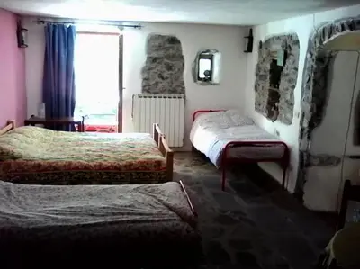 Letto o letti in una camera di Il Borgo della Colomba