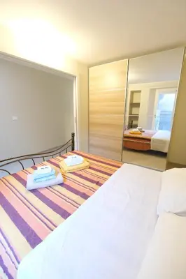 Letto o letti in una camera di Piccola Bomboniera & Gimasi by PortofinoVacanze
