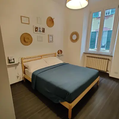 Letto o letti in una camera di Vista sul carruggio, centro storico di Chiavari