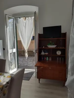 TV o dispositivi per l'intrattenimento presso Tigullio Vacations - Flavia beach apartment