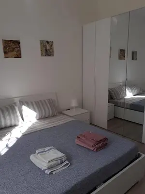 Letto o letti in una camera di Tigullio Vacations - Flavia beach apartment