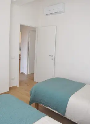 Letto o letti in una camera di Verdi Due