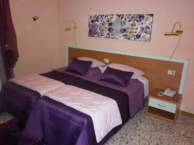 Letto o letti in una camera di Hotel San Donnino