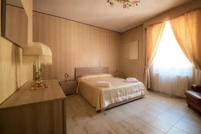 Letto o letti in una camera di Casa Vacanze Dante