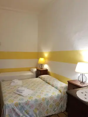 Letto o letti in una camera di Norina's House
