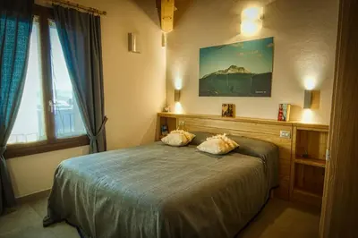 Letto o letti in una camera di PaeseMio Cervarezza di Bolzoni Maria Graziella