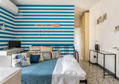 Letto o letti in una camera di Aria di mare