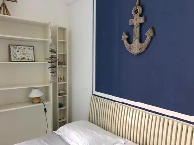 Letto o letti in una camera di Aria di mare