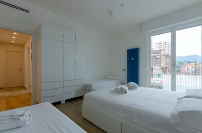 Letto o letti in una camera di JOIVY Spacious 2-bedroom flat with Balcony near Beach in Sestri Levante