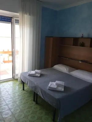 Letto o letti in una camera di Albergo Stella Di Mare