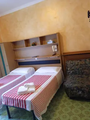 Letto o letti in una camera di Albergo Stella Di Mare