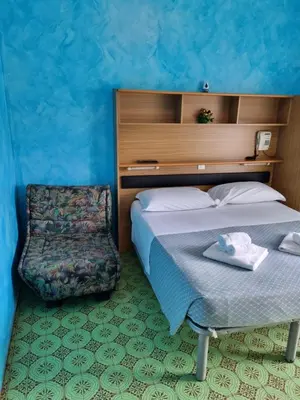 Letto o letti in una camera di Albergo Stella Di Mare