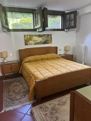 Letto o letti in una camera di VILLA ISELLA