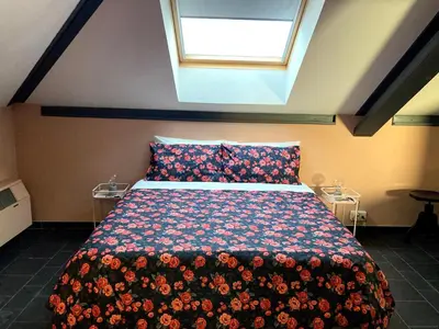 Letto o letti in una camera di Il Loft di Villa al Parco