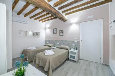 Letto o letti in una camera di Residenza Borgo Guazzo