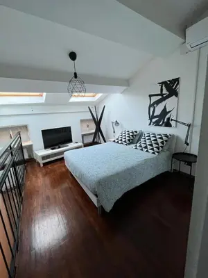 Letto o letti in una camera di Sophia's Loft