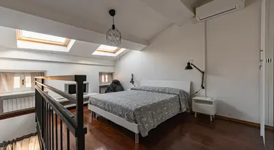 Letto o letti in una camera di Sophia's Loft