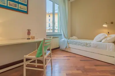 Letto o letti in una camera di CASA CLAUDIA Relax con Patio e Parcheggio
