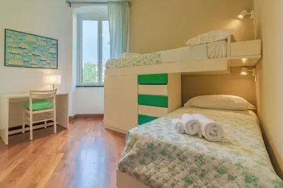 Letto o letti in una camera di CASA CLAUDIA Relax con Patio e Parcheggio