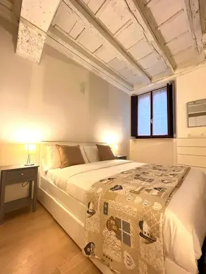 Letto o letti in una camera di RESIDENZA SERENA SUITE-Centro Storico