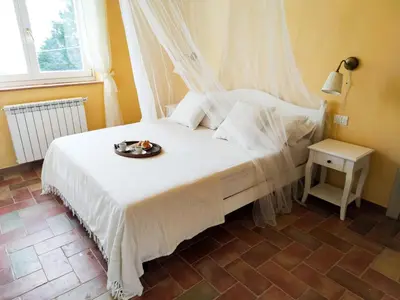 Letto o letti in una camera di AntiquaeLunae Casali