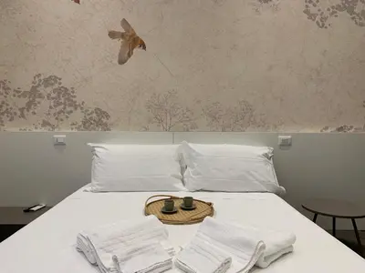 Letto o letti in una camera di Niki O. Charme