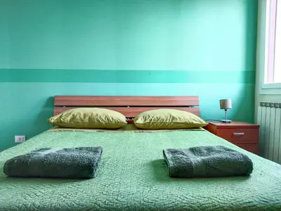 Letto o letti in una camera di Casa Bignardi - Affitti Brevi Italia
