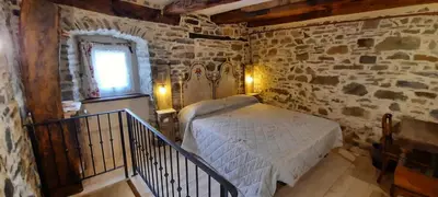Letto o letti in una camera di b&b La Corte dei Cerri- Il Piccolo Chalet