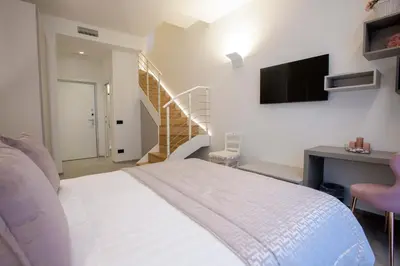 Letto o letti in una camera di VistAmare Luxury Retreat Appartamenti