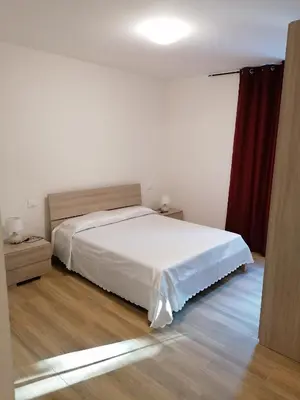 Letto o letti in una camera di Le camelie