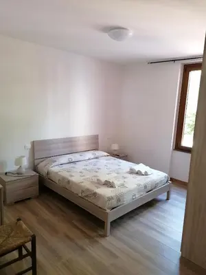 Letto o letti in una camera di Le camelie